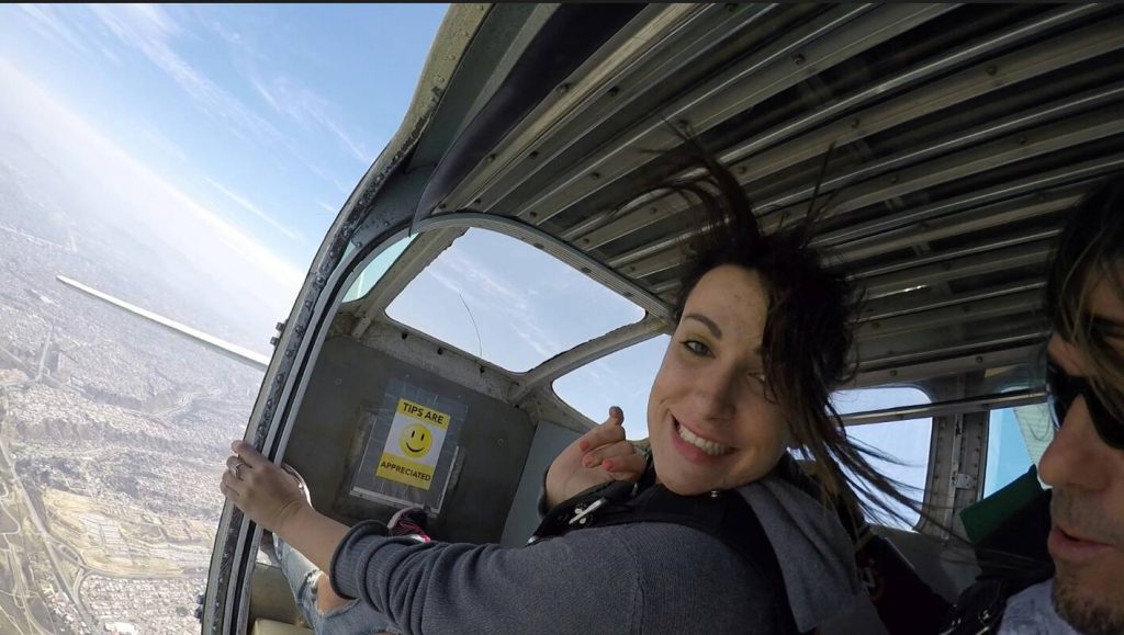 woman skydiving in San Diego, Blair Nicole of California Travel Insider skydiving at Pacific coast skydiving